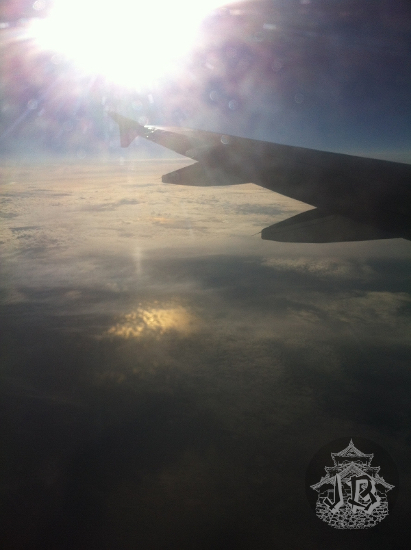 The sun is shining on the plane window