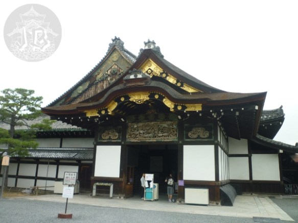The main building to the old castle. Is is built in dark wood with gold ornaments and carved details showing animals and plants, painted in bright colours