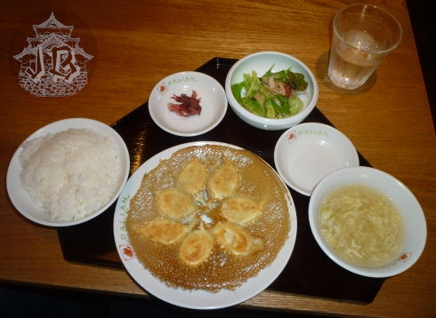 Chinese food - rice, dumplings, soup, pickles