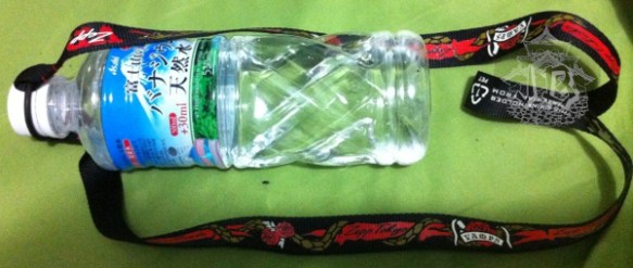 A bottle with a lanyard to hang it around your neck