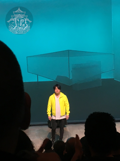 Picture of the composer, dressed in yellow