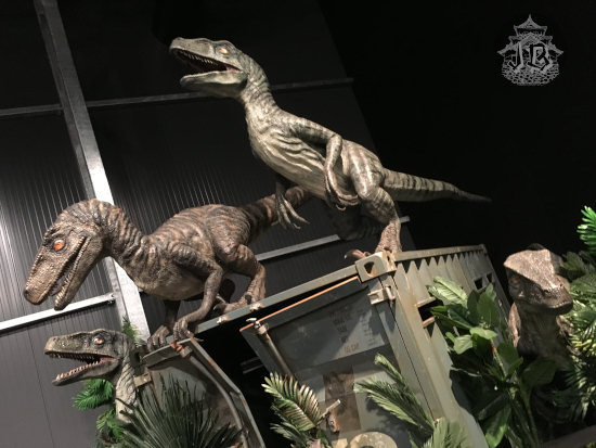 Jurassic world velociraptors on a wrecked crate