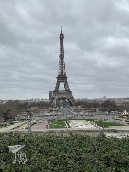The Eiffel Tower in front of a cloudy sky