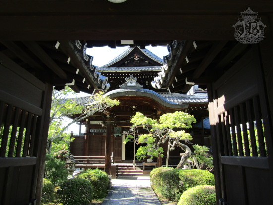 A Buddhist temple through the wooden gate