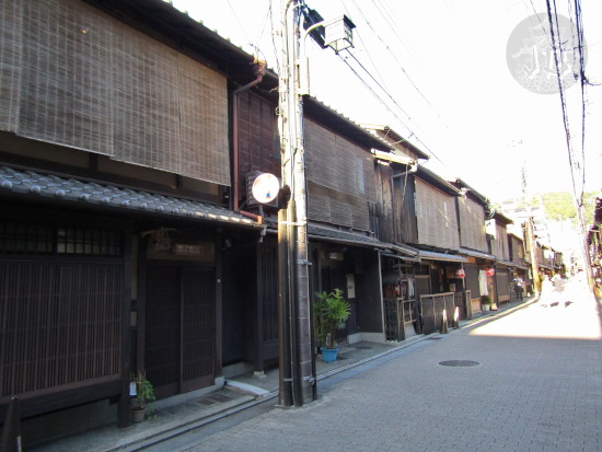Wooden houses in the sun, the wood is dark