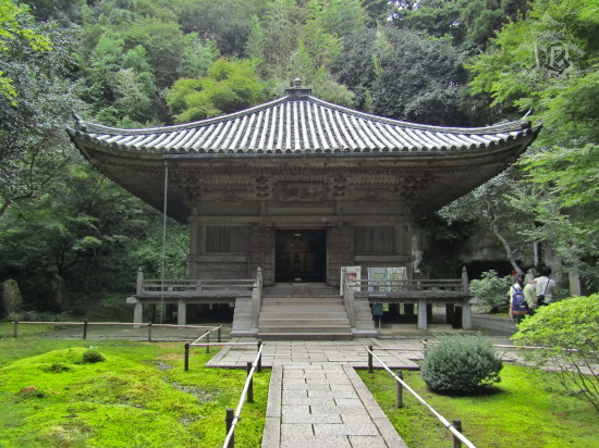 Main building of a temple. It's made of wood so old that it has turned white-grey