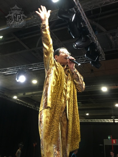 Japanese man in a Leopard print suit singing
