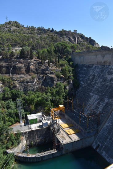 The electricity power-plant that is fed by the water behind the dam. There are a lot of wires coming out at different heights.