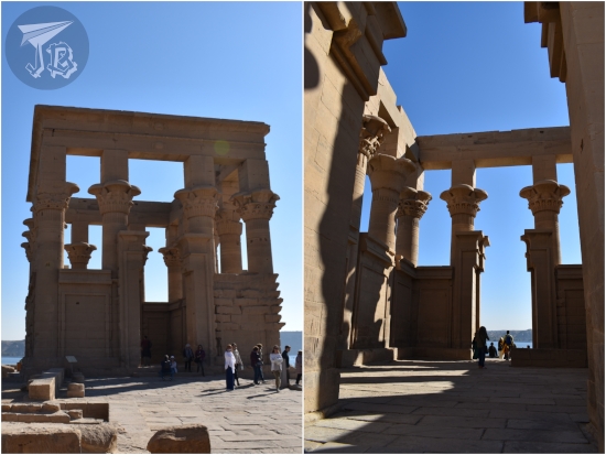 A cube-like structure built from columns, with the river behind them.