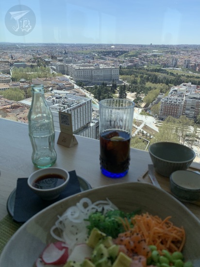 Rooftop picture showing Madrid's Plaza de España and Royal Palace. Blurred in the foreground, lunch