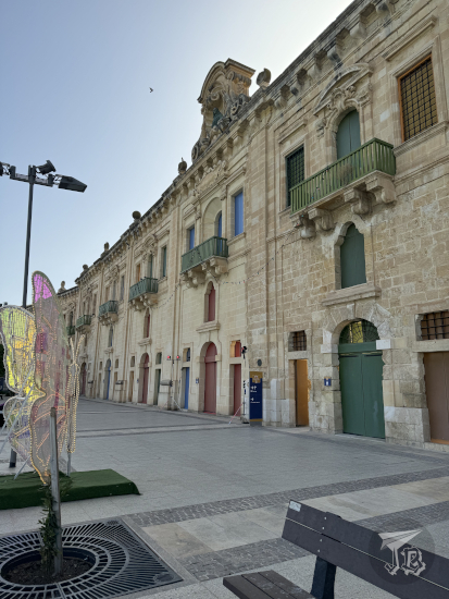 Valletta Waterfront: a line of neoclassical warehouses and buildings turned into shops and eateries