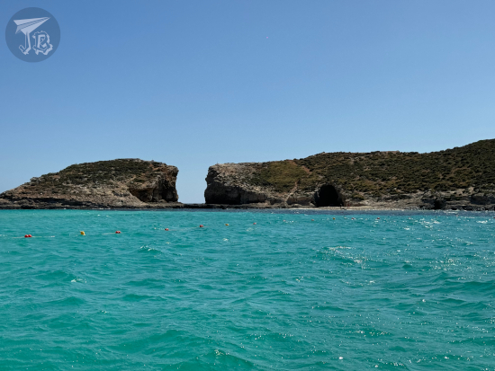 The turquoise water of the blue lagoon in front of the island of Comino