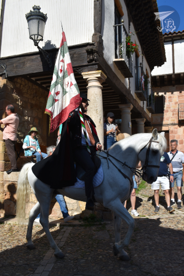 Caballada de Atienza: Horse parade in a Medieval Village. Senior brother carrying the flag