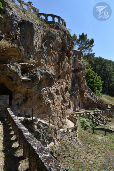 Cívica, a venue built into a vertical wall, with balaustrades and balconies, from the garden