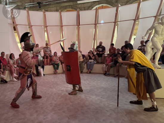 Gladiators fighting. The light-weight is launching his spear forward