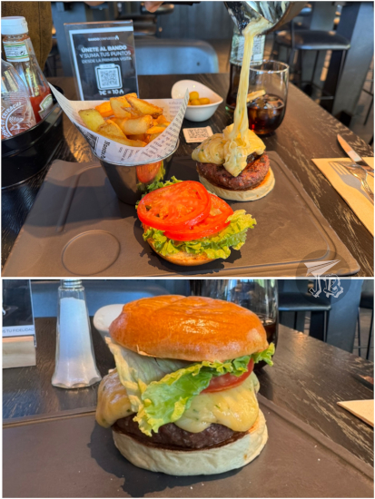 Hamburger being bathed over with melted cheese.