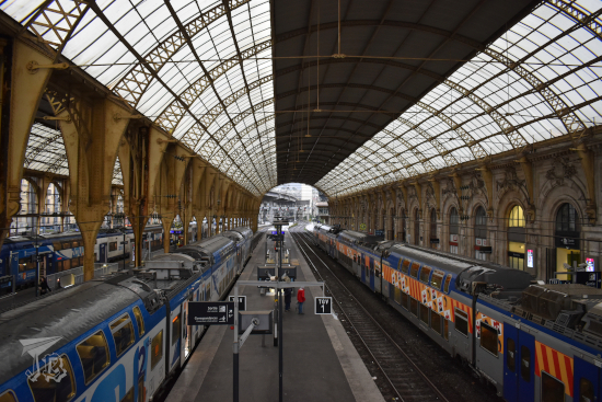 In the train shed of Gare de Nice - glass ceilings and wrought iron beams.