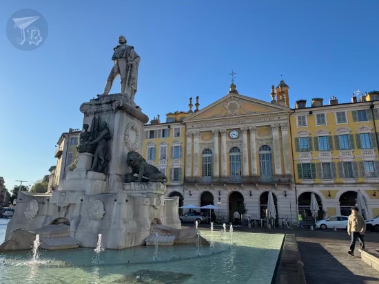 Place Garibaldi, with a statue and Italian-style buildings.