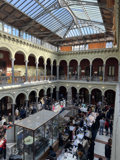 Interior of the ETSIME - two floors of arcades and a glass and iron ceiling.