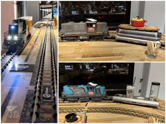 Little trains and railways carrying food and drinks.