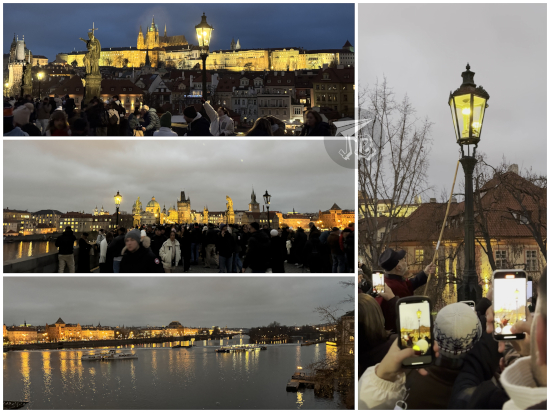 Charles bridge, with an official lighting a gas streetlight.
