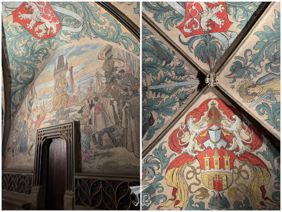 Small hall in Prague town hall, decorated with frescoes on the ceiling and walls depicting historical scenes and herald motifs.