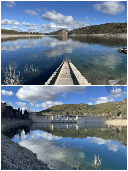 Tranquil reservoir. Some stairs disappear into the water.