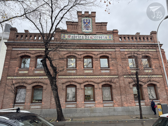 Old brewery built in brick with an eagle mosaic as logo