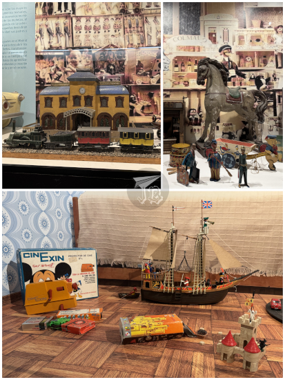 Old toys - tin train station and horse, a plastic castle and a plastic pirate ship