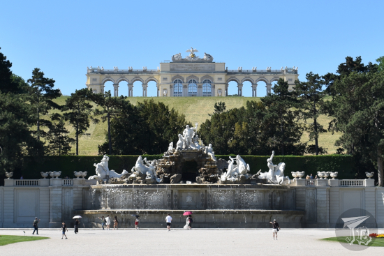 Fountain with Greek Gods and a monument in the background