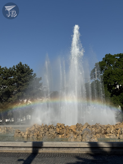Fountain with a rainbow running across